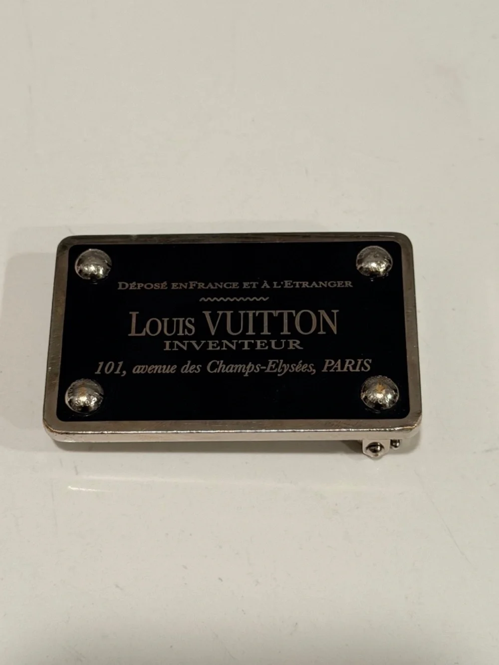 2 Luis Vuitton belt buckles